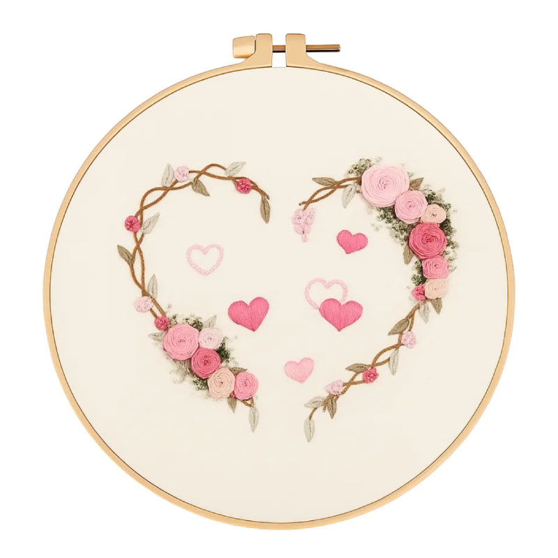 Embroidery hoop with floral heart design on a white background