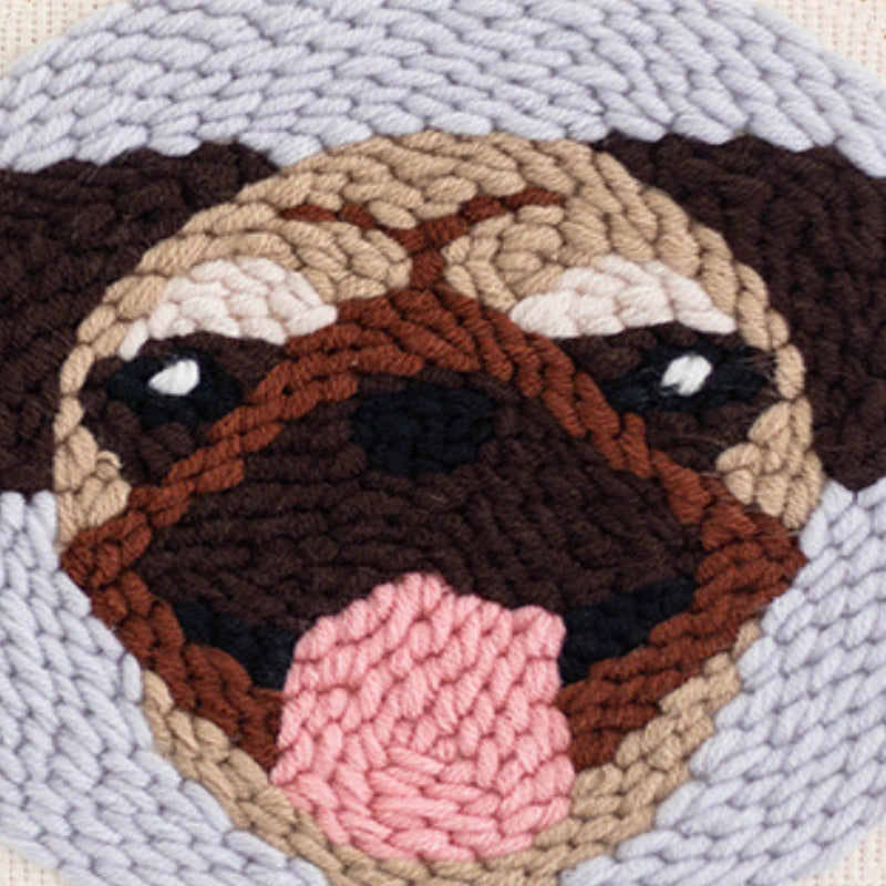 Close-up of a textured fabric with a dog's face design