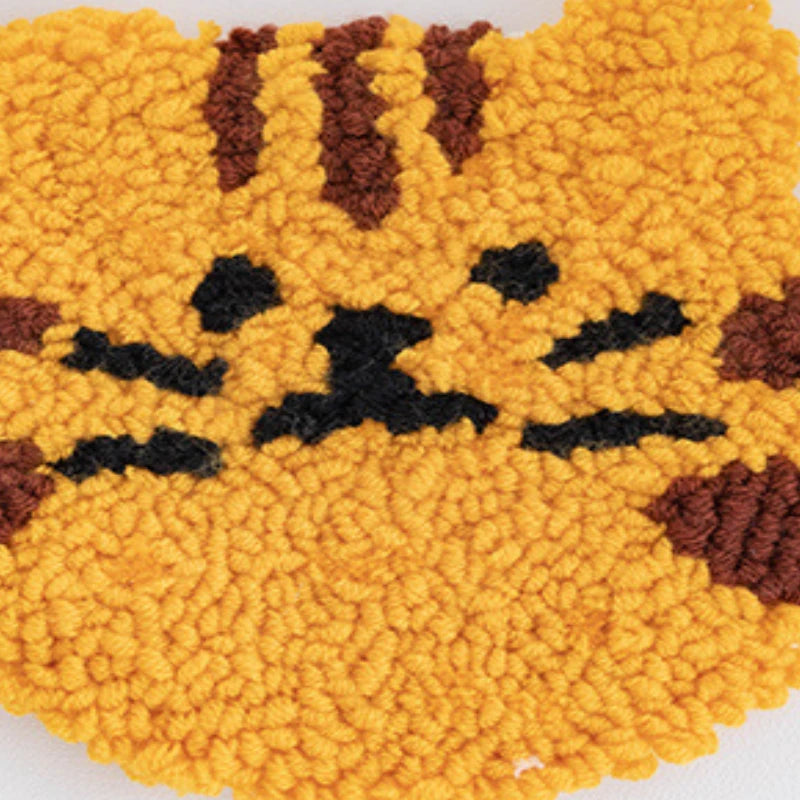 Close-up of a textured yellow surface with black and brown patterns resembling a face.