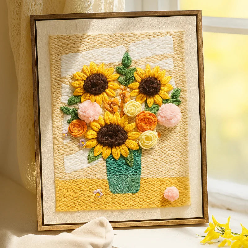 Framed woven art piece with sunflowers and flowers on a textured background
