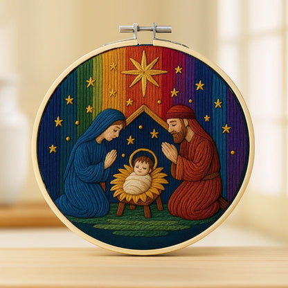 This embroidery beautifully portrays the nativity moment — Mary and Joseph kneeling in reverence before baby Jesus under a radiant golden star.
The background glows with a spectrum of rich, rainbow-like hues, symbolizing hope, faith, and divine grace.
Every stitch shines with warmth and serenity, filling the heart with peace and blessings.