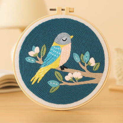 A peaceful bird rests on a blooming branch, surrounded by calm night hues.
