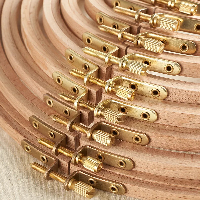 Wooden dowels with brass connectors arranged in a circular pattern.