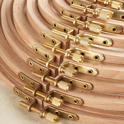 Wooden dowels with brass connectors arranged in a circular pattern.