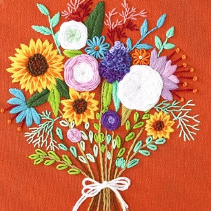 Embroidered bouquet of flowers on a red background