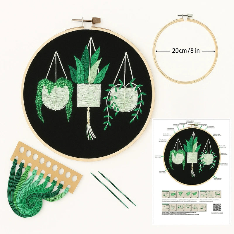 Embroidery hoop with pre-printed design, green thread, and instruction sheet on a white background