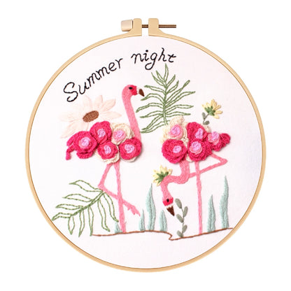 Embroidery hoop with pink flamingos and floral design, labeled 'Summer night'.