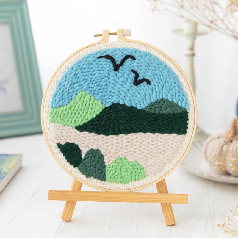 A peaceful mountain view with soft greens and blues, two birds flying across the sky, symbolizing calm and freedom in nature.
