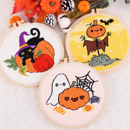 Each punch needle design — from the mischievous black cat in a pumpkin to the cheerful ghost and scarecrow