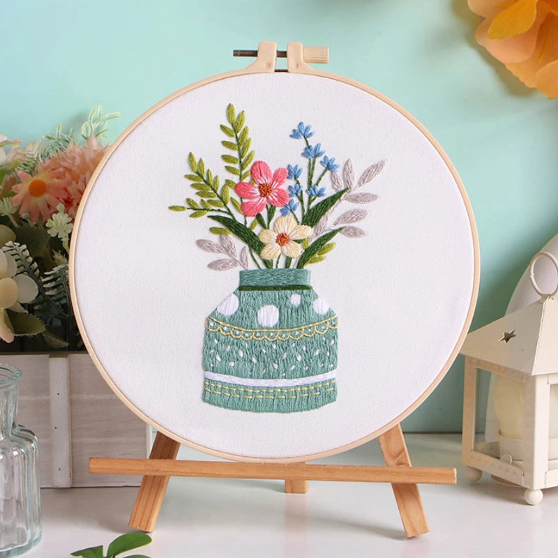 Meadow Harmony captures the tranquil charm of wildflowers gathered in a soft green vase. The gentle blend of red, blue, and cream tones reflects the balance of nature — calm, vibrant, and full of life. A perfect piece to bring a refreshing touch of the countryside into your home.