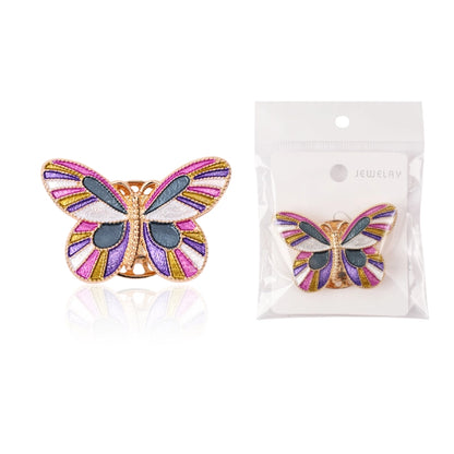 Butterfly-shaped jewelry item with packaging on a white background