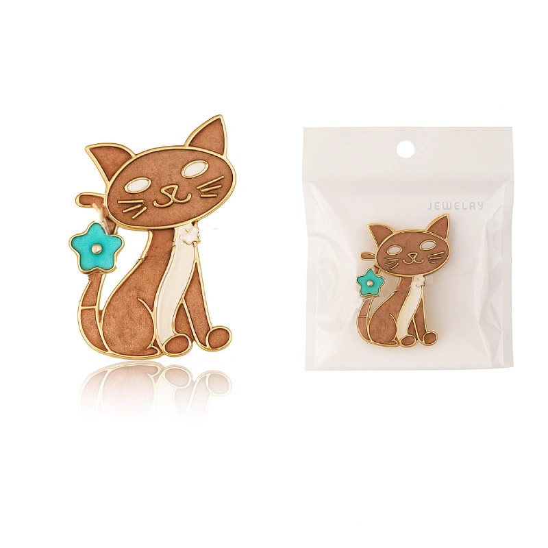 Cat-shaped jewelry with a blue flower detail on a white background