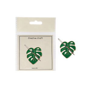 Green leaf-shaped earrings on a 'Creative Craft' branded card against a white background