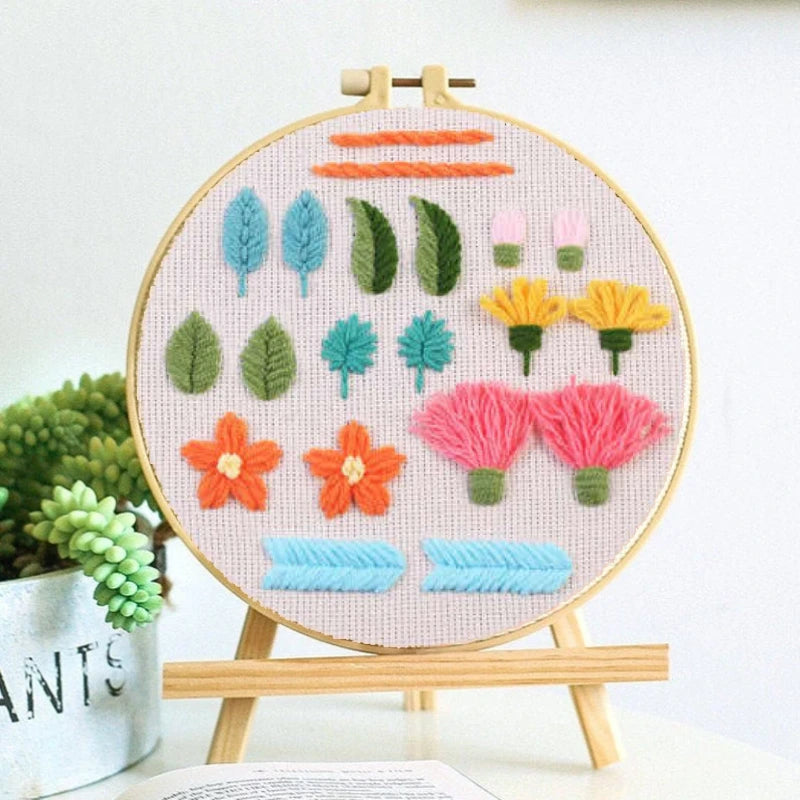 Inspired by nature, with leaves, petals, and blooming flowers in soft shades of pink, yellow, orange, and green. Ideal for learning petal and leaf embroidery techniques.