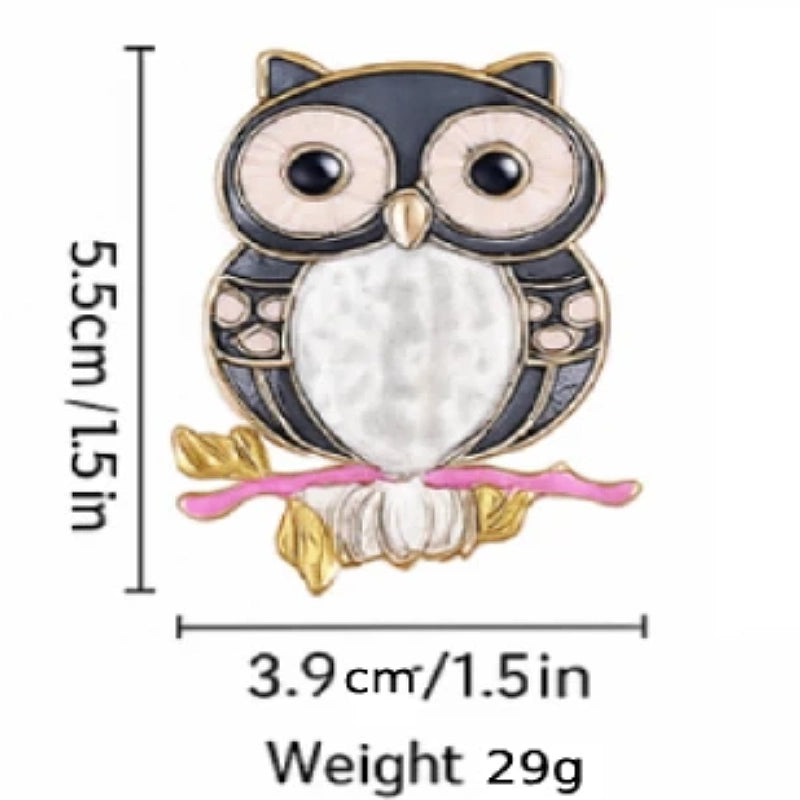 Owl-shaped brooch with measurements and weight on a white background