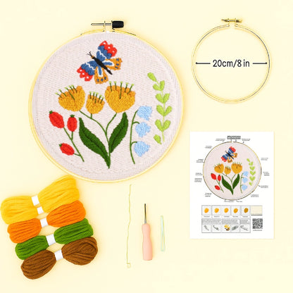 Embroidery hoop with floral design, yarn colors, and instructions on a light yellow background