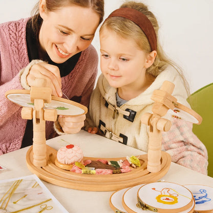 Woman and child engaged in a craft activity with wooden tools and materials on a table.
